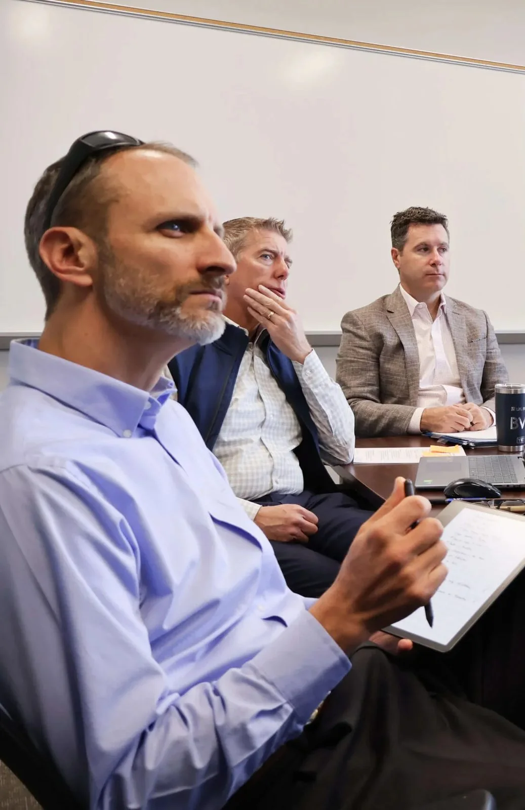 Wealth Clarity financial advisors reviewing a client financial plan during a team planning meeting